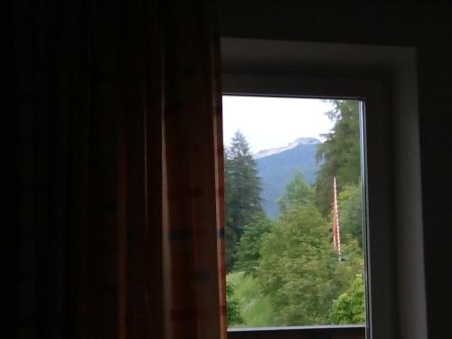 a window with a view of a mountain at Hotel Schönwies in Trodena