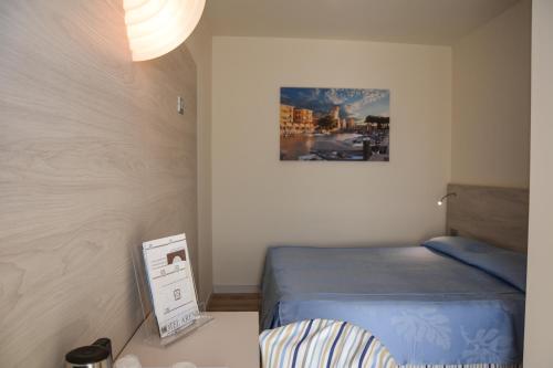 Ένα ή περισσότερα κρεβάτια σε δωμάτιο στο Hotel Arena