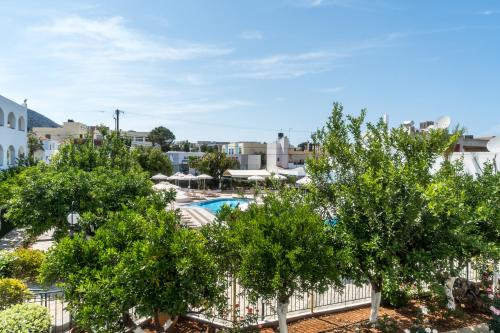 a view of the pool from the balcony of a resort at Hotel Malia Holidays in Malia