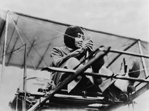 a man sitting on top of an airplane at Les Camuches de la fonderie in Tournai