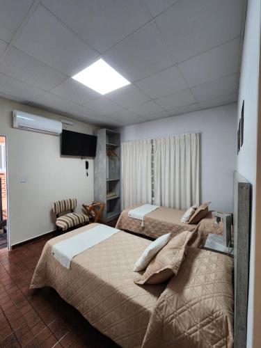 Ένα ή περισσότερα κρεβάτια σε δωμάτιο στο HOTEL Parque
