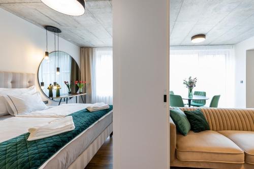 A bed or beds in a room at H75 Apartments Kosice Centre
