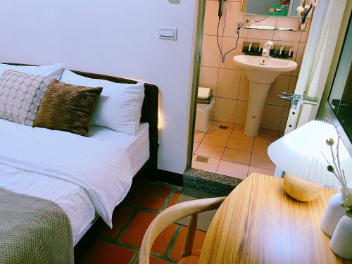 Cama o camas de una habitación en 珠山官邸-金門古厝民宿