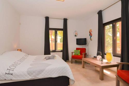 Ένα ή περισσότερα κρεβάτια σε δωμάτιο στο Villa Barranca