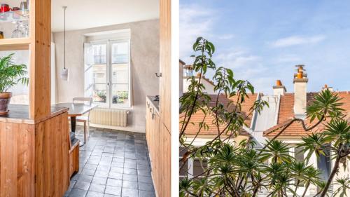 Il comprend une cuisine et un balcon offrant une vue sur un bâtiment. dans l'établissement Famous parisian designer's pied-à-terre in Le Marais, à Paris