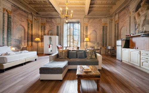 a living room with a couch and a table at Era Rental Apartments in Florence