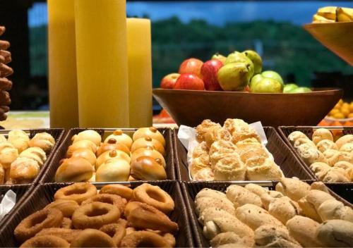 a display of different types of pastries and fruit at Samoa Beach Resort in Porto De Galinhas