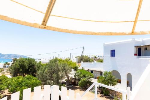 a view from the balcony of a white house at Sorokos Koufonissia in Koufonisia