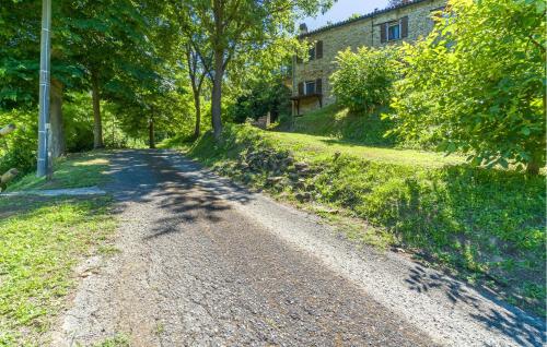 a dirt road in front of a building at Lovely Apartment In Monastero Bormida in Monastero Bormida