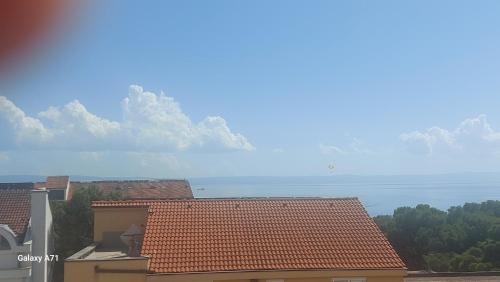 a view of the ocean from the roof of a building at The best location in Makarska,free P, option bikes in Makarska
