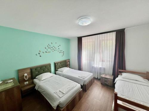 Postel nebo postele na pokoji v ubytování Vila Alexander B&B