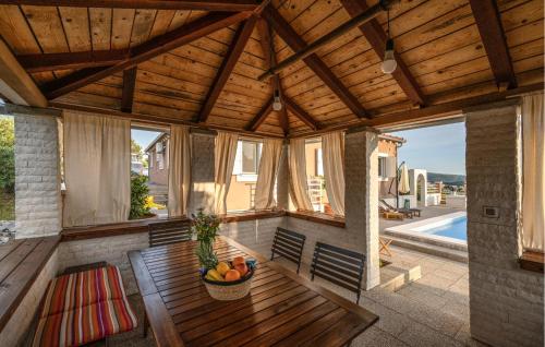 a room with a table with a bowl of fruit on it at Terracotta in Zaboric