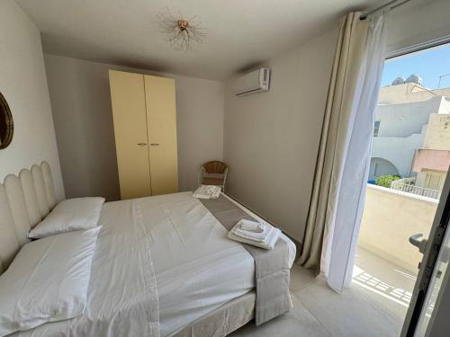 Ένα ή περισσότερα κρεβάτια σε δωμάτιο στο Panima Rooms