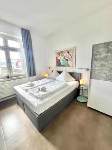 Ένα ή περισσότερα κρεβάτια σε δωμάτιο στο GuestHouse Bielefeld - Brake