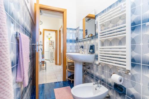 a bathroom with a sink and a toilet at I Mori Cà in Modica