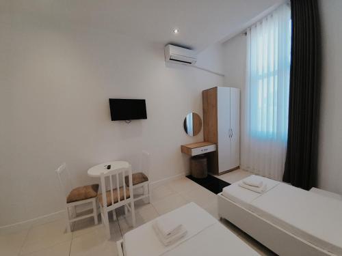 TV a/nebo společenská místnost v ubytování Hotel Restaurant Univers