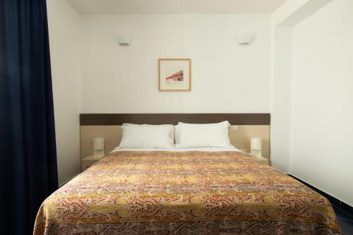 Postel nebo postele na pokoji v ubytování Tuareg Hotel