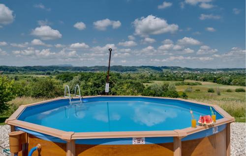 a pool with a view of the rolling hills at Beautiful Home In Stubicka Slatina in Stubička Slatina