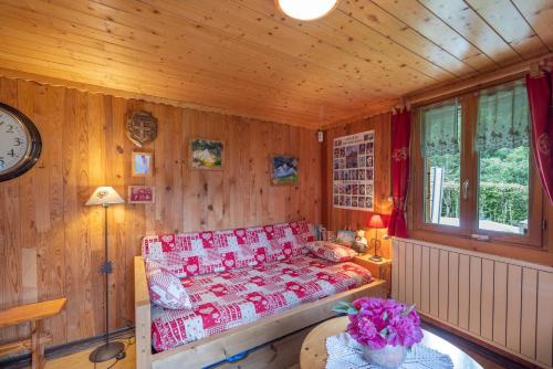 Ένα ή περισσότερα κρεβάτια σε δωμάτιο στο Le vieux chalet