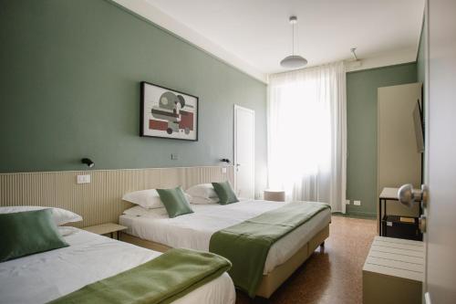 Ένα ή περισσότερα κρεβάτια σε δωμάτιο στο Hotel San Marco Sestola