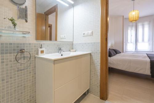 Postel nebo postele na pokoji v ubytování Apartamento Amelia Campello