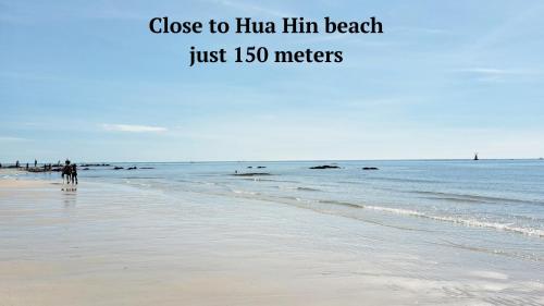 a beach with the words close to hino him beach just meters at Thipurai City Hotel in Hua Hin