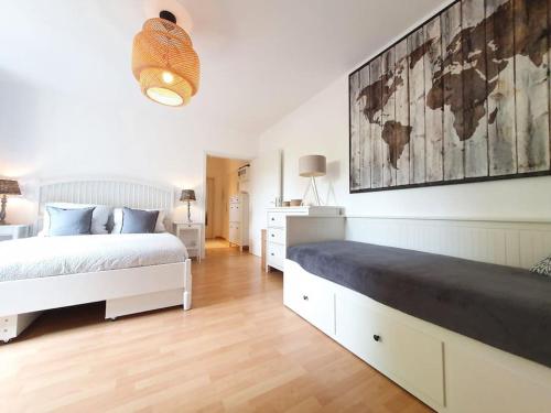a bedroom with a bed and a map on the wall at Two room Apartment in Dresden Neustadt with balcony in Dresden
