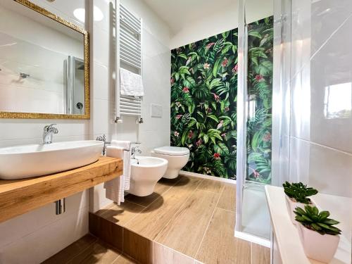 a bathroom with a sink and a toilet and a shower at Portion of Villa with Private pool in Vaglia