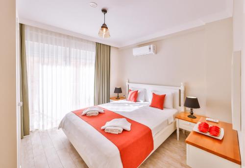 Ένα ή περισσότερα κρεβάτια σε δωμάτιο στο Begonya Suites
