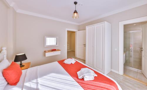 Ένα ή περισσότερα κρεβάτια σε δωμάτιο στο Begonya Suites