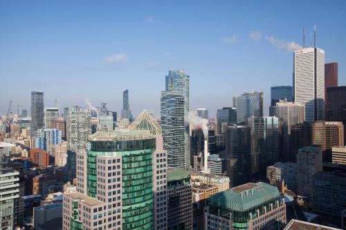 an aerial view of a city with tall buildings at 3BR Skyline Condo - By CN Tower & MTCC & Free Parking in Toronto