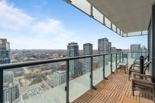 an apartment balcony with a view of the city at 3BR Skyline Condo - By CN Tower & MTCC & Free Parking in Toronto