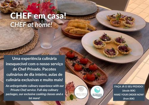 a table with plates of food on top of it at Bay View by OCvillas in Albufeira