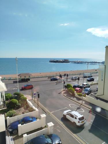 a view of a parking lot with a beach at The Willows in Brighton & Hove