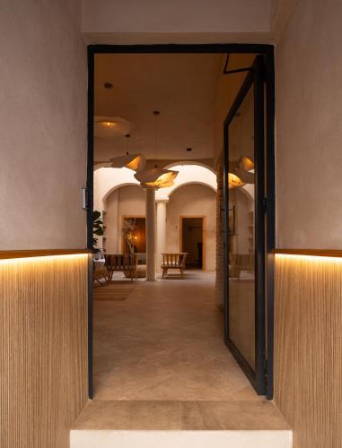 an open door to a hallway in a building at VICTORIA - by Ático73 in Medina Sidonia