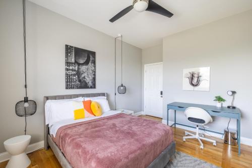 a bedroom with a bed and a desk at Kenwood Apartments, Downtown Hyde Park in Chicago
