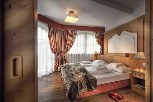 Postel nebo postele na pokoji v ubytování Hotel Alte Mühle 4 Stelle