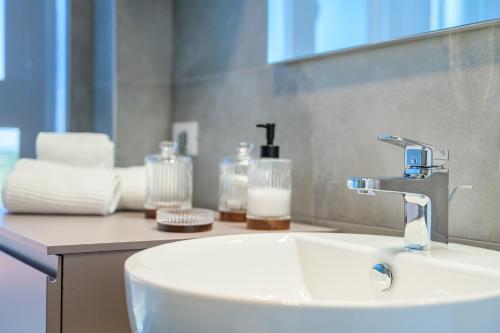 a bathroom sink with a faucet on a counter at Tiny House Tower in Fidenza