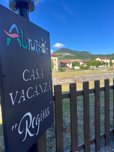 a sign in front of a fence at Casa Vacanza Regina in Roccaraso