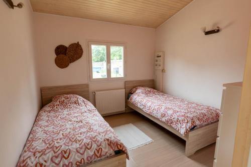 Una cama o camas en una habitación de En face des vignes