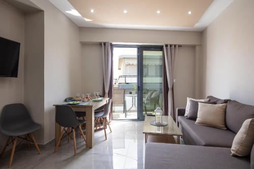 a living room with a couch and a table at Nick and Helen in Rethymno Town
