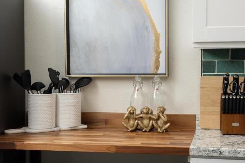 a kitchen counter with three little figurines on it at Denver Emerald - Close to Red Rocks, Arvada & Downtown in Denver