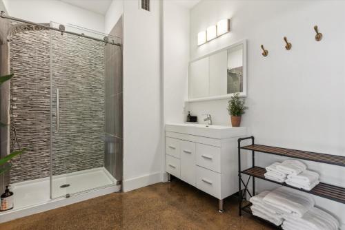 a bathroom with a shower and a sink at Large Studios, 1BR, Free Parking Gym, Game Room in Philadelphia
