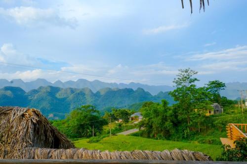 a view of a hill with mountains in the background at Pu Luong Jungle Lodge in Pu Luong