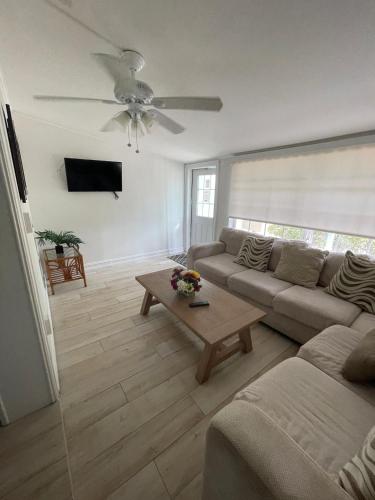 a living room with a couch and a table at Kings Kamp in Key Largo