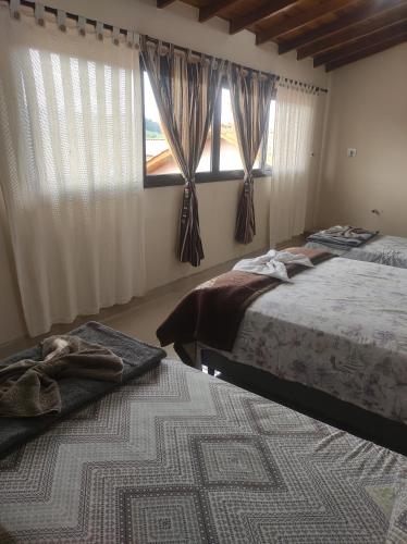 Postel nebo postele na pokoji v ubytování Nosso Canto Casa de Hóspedes