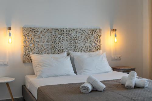 a bedroom with a bed with towels on it at Summer Residence in Provatas