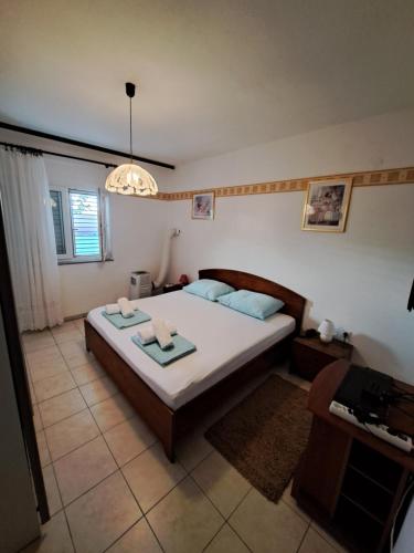 Posteľ alebo postele v izbe v ubytovaní Apartman LETI