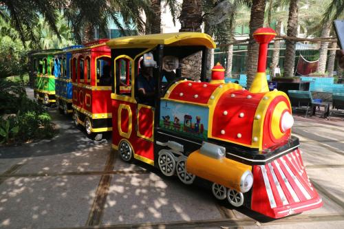 a toy train is on the tracks at Lagoona Beach Luxury Resort and Spa in Manama