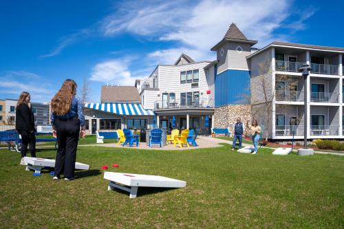 a group of people standing in front of a building at Park Point Marina Inn in Duluth